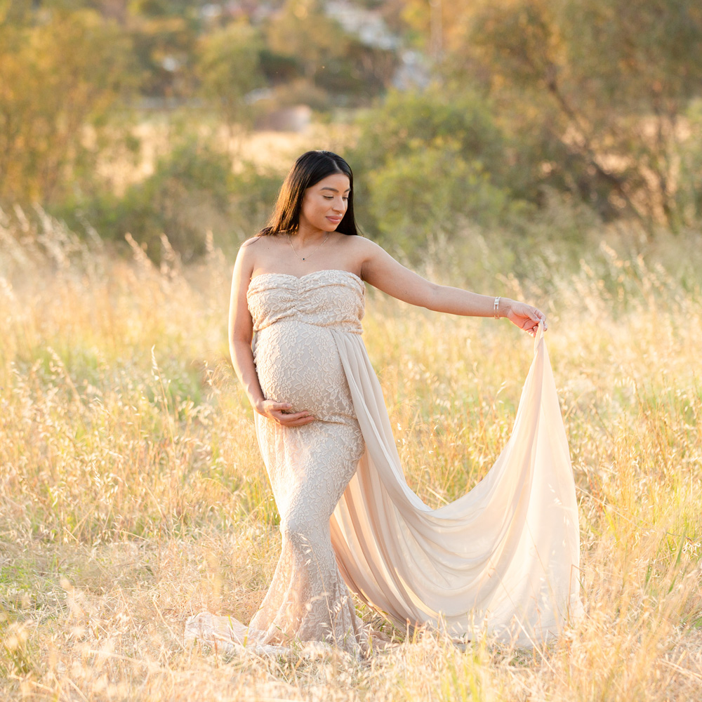 woman-in-a-cream-dress-poising-for-her-adelaide-maternity-photography-session
