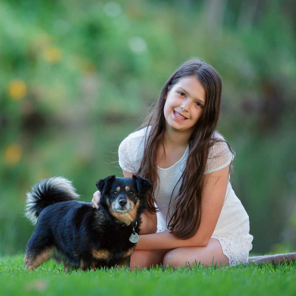 young-girl-with-her dog-at-a-park