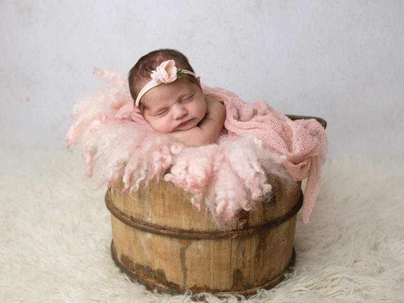 baby-girl-photo-sleeping-in-a bucket-for-newborn-session
