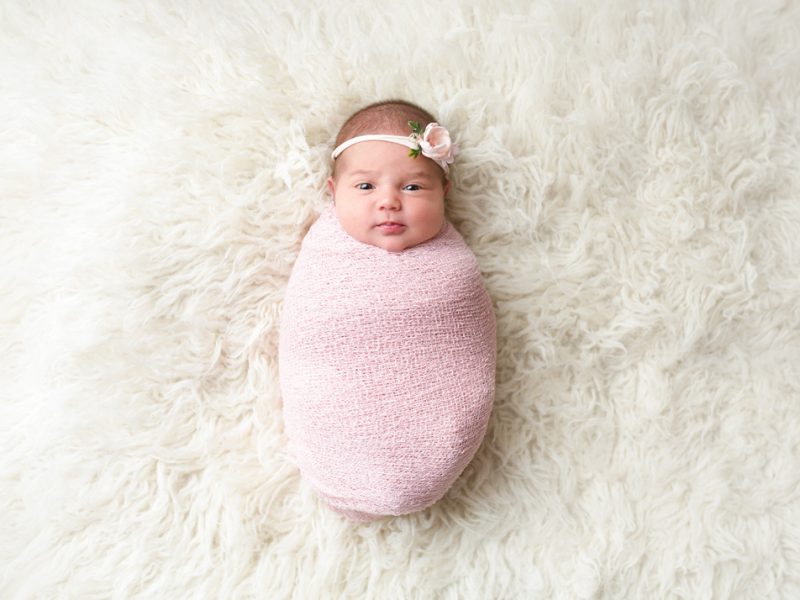 newborn-baby-girl-wrapped-in-pink-wrap
