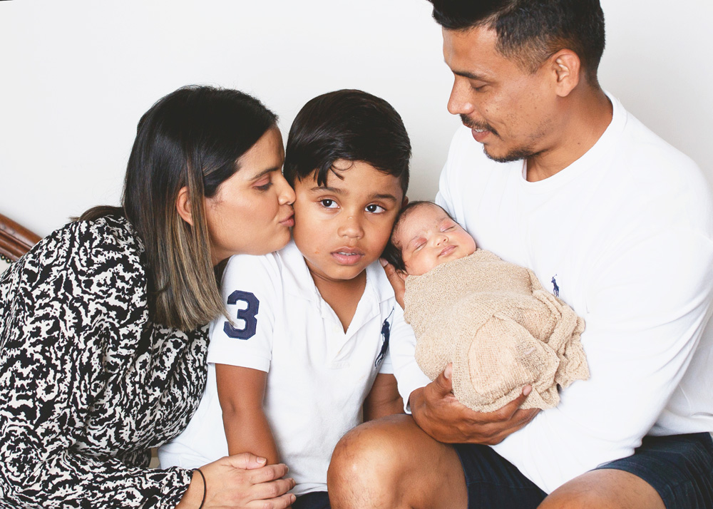 family-sitting-together-with-new-baby