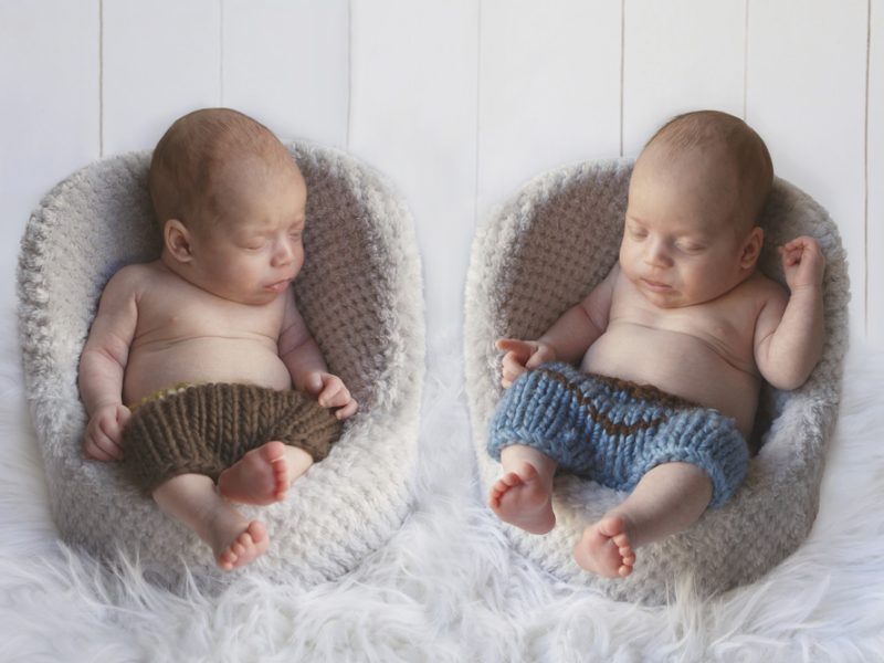 twin-newborn-boys-sleeping-in-little-chairs-for-adelaide-newborn-session
