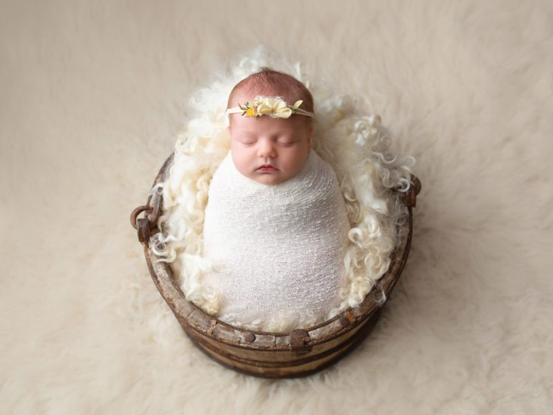 newborn-photo-of-baby-in-a-wooden-bucket