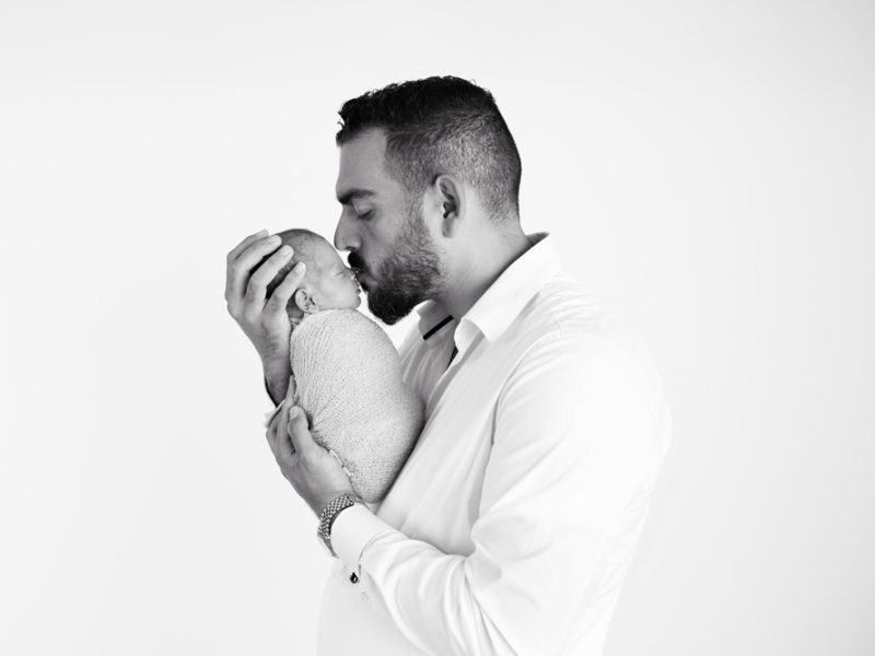 Dad-kissing-baby-girl